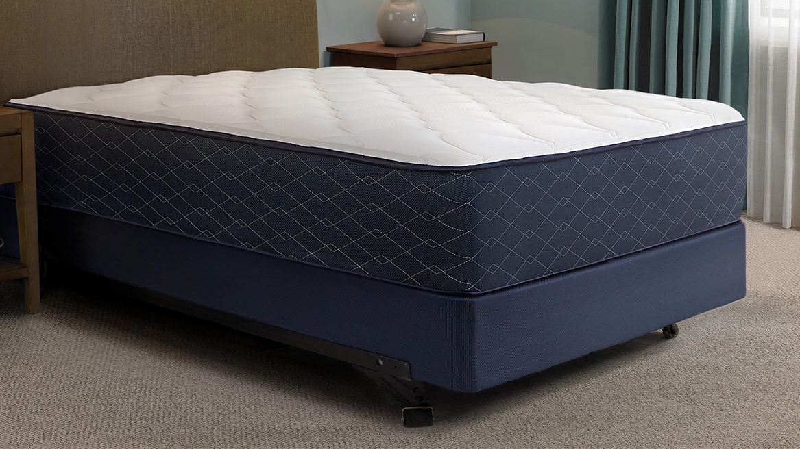 The Hampton Mattress on a bed frame in a Hampton Hotel bedroom