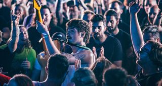 Bicurious' Taran Plouzané puts everything into it as he plays his Squier Jazzmaster ArcTangentFestival – he even ended up in amongst the crowd.