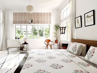 a neutral bedroom with printed window blind material