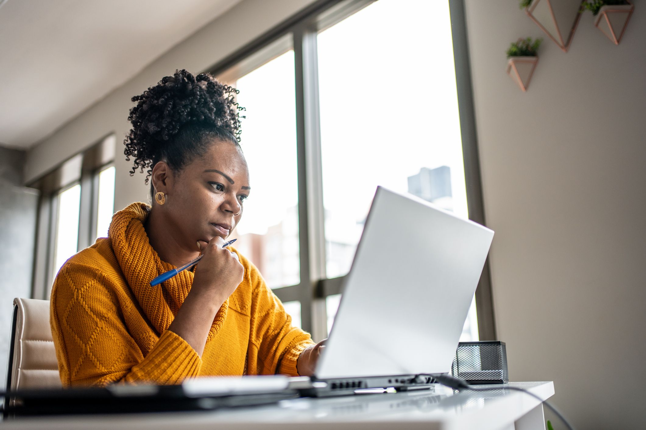 Woman researching pension at home
