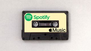 An audio tape with the logos for Spotify and Apple Music on it