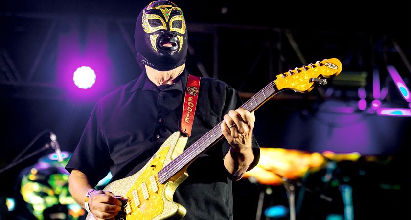 Eddie Angel of Los Straitjackets wears a Luchador mask and plays a funky looking offset with four single-coil pickups