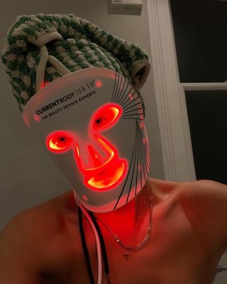 Lucy Williams wearing CurrentBody's LED Face Mask.