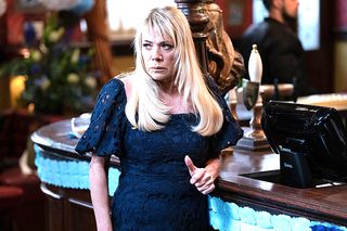 EastEnders Sharon looks annoyed at the bar in The Queen Vic