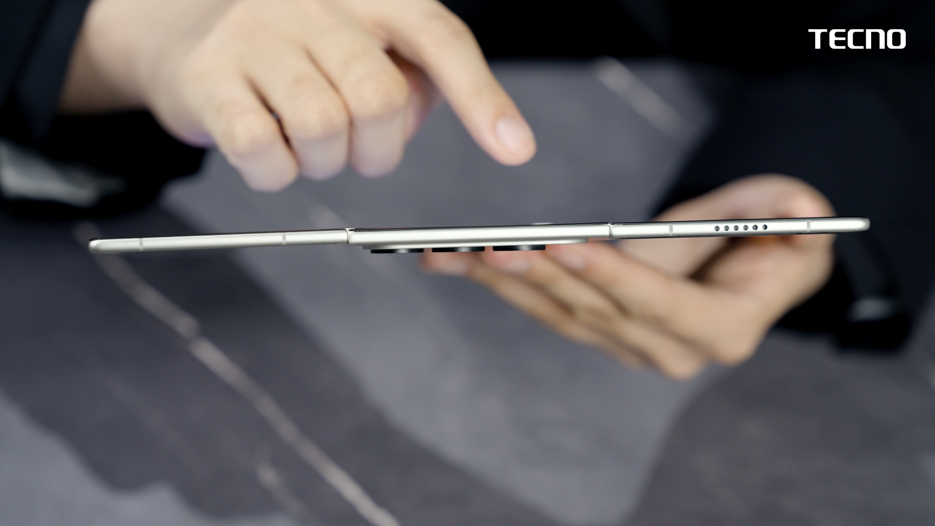 The TECNO Phantom Ultimate G Fold fully open, showing off its incredibly thin profile.
