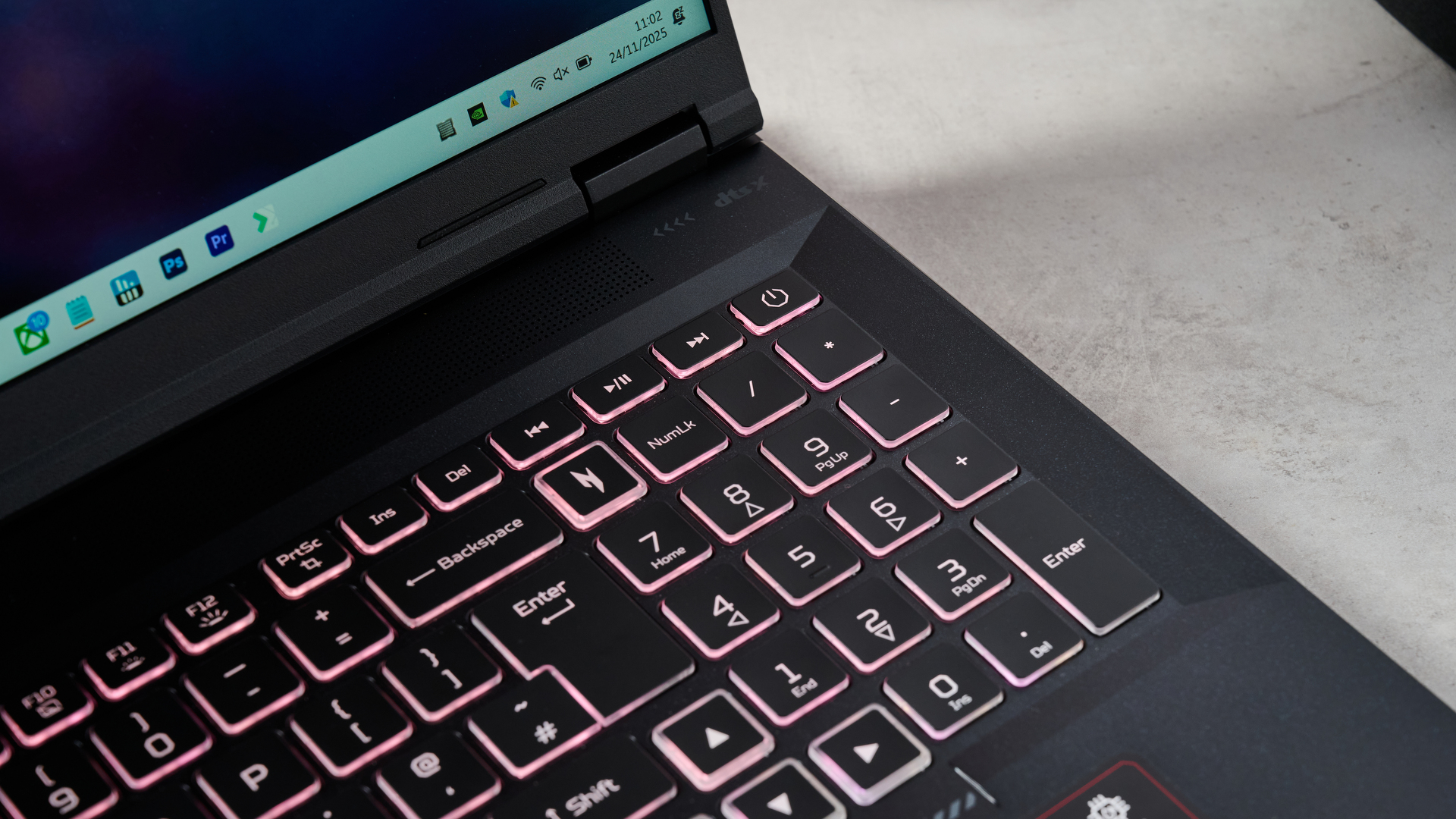 Close-up of number pad on Acer Nitro 18 AI with keyboard backlighting on