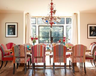 A colorful dining room in a country home in Sussex designed by Kate Forman