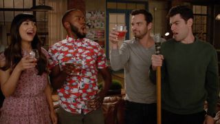 A screenshot of (from left to right) Cece, Winston, Nick and Schmidt cheers in New Girl.