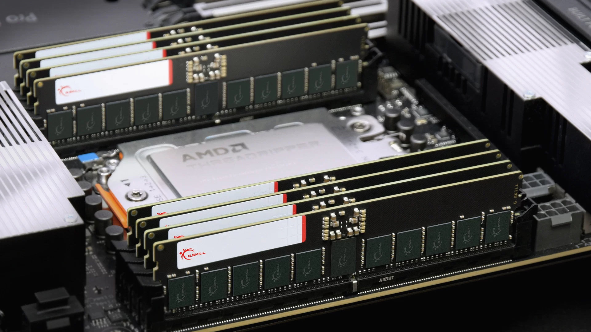 A promotional image from G.Skill showing the RAM makers DDR5 RDIMMs filling all eight memory slots of a Threadripper motherboard.