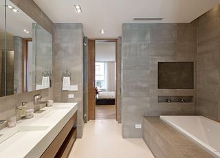 bathroom with with limestone baths and rain showers