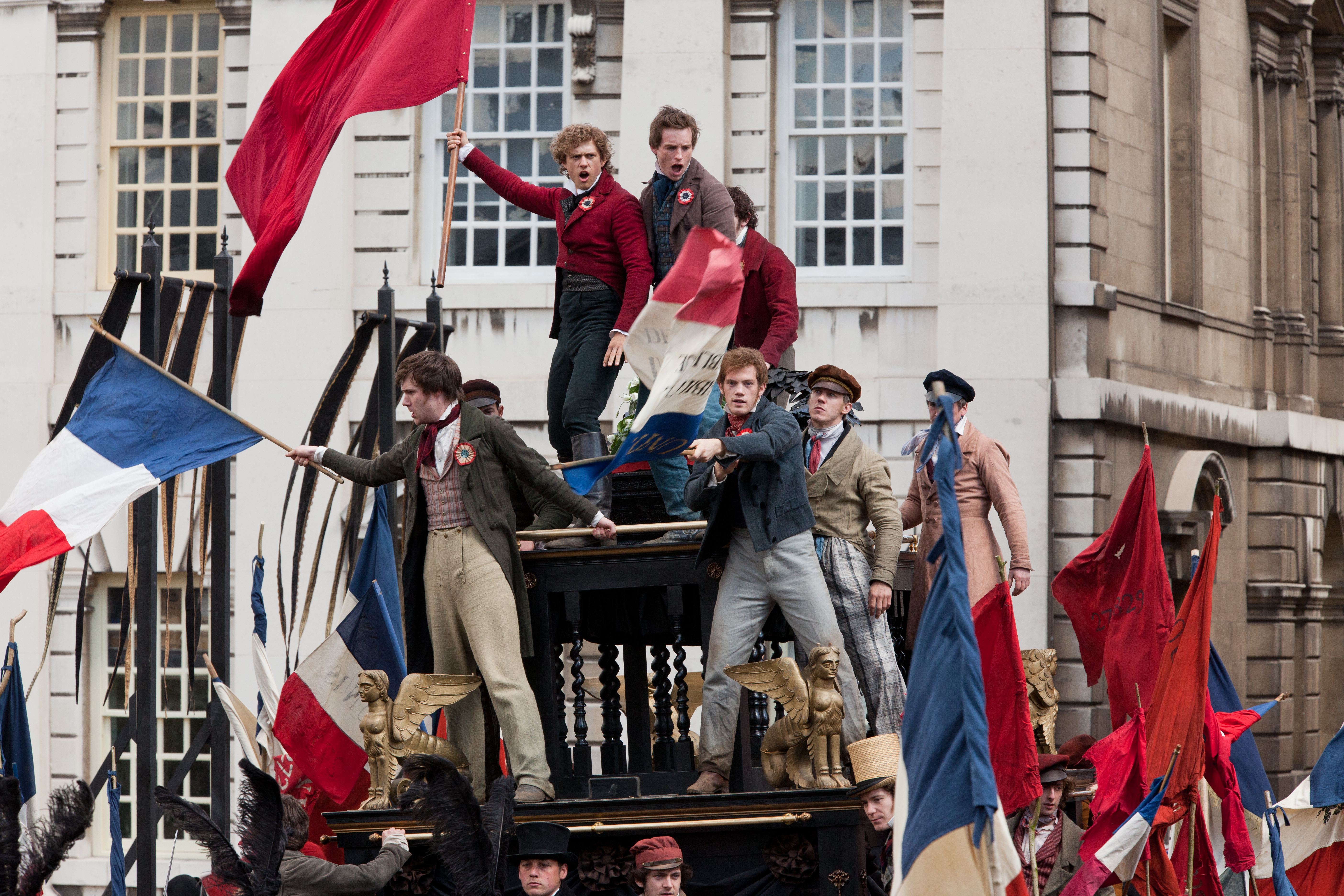 Aaron Tveit and Eddie Redmayne in Les Miserables