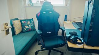 A black Boulies Ninja Pro chair in a small office