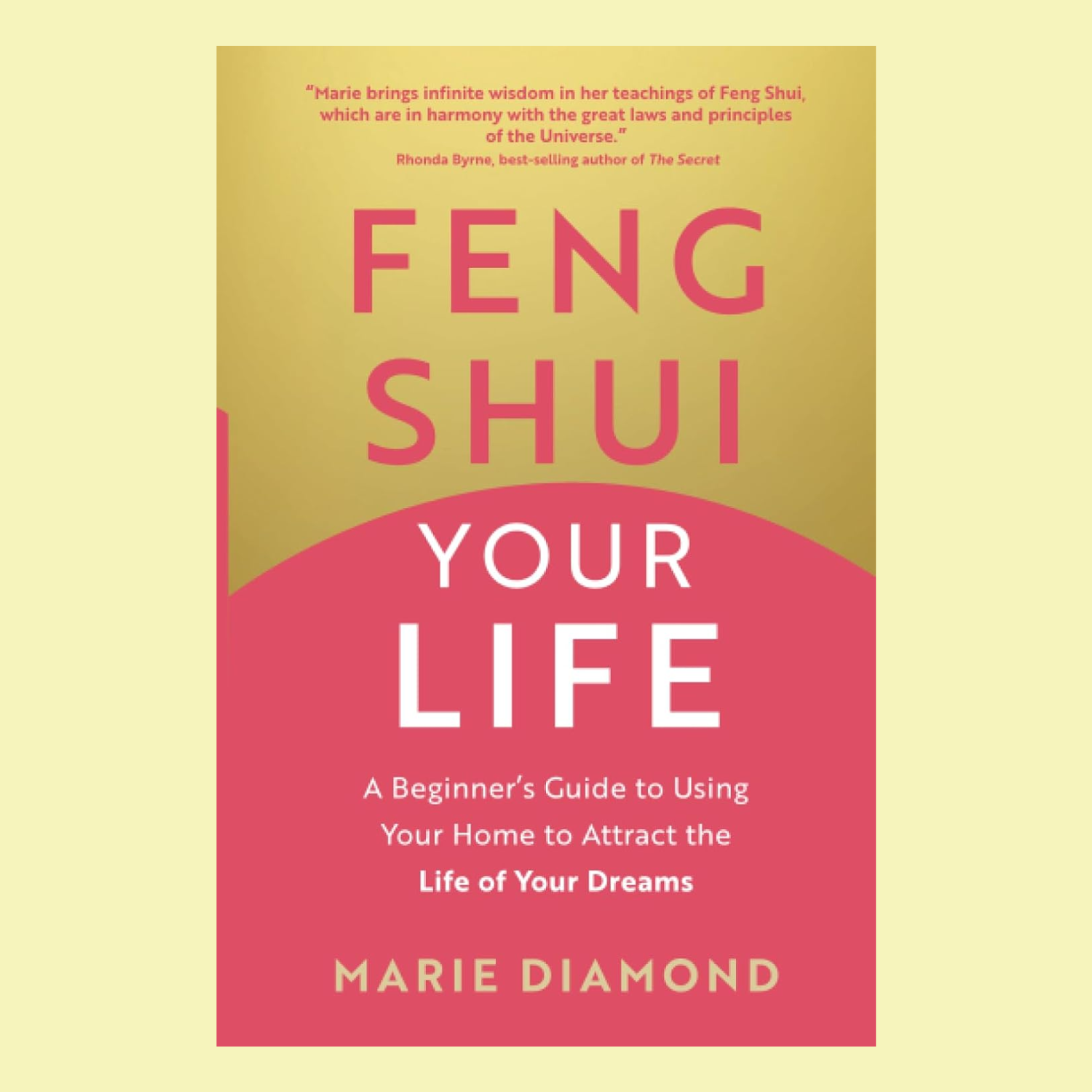 A book with a gold and coral cover titled 'Feng Shui Your Life'