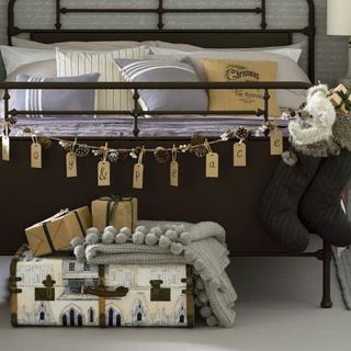 bedroom with luggage tag garland