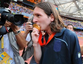 Lionel Messi kisses his Olympic gold medal after Argentina's win over Nigeria in the final of the football tournament in Beijing in August 2008.