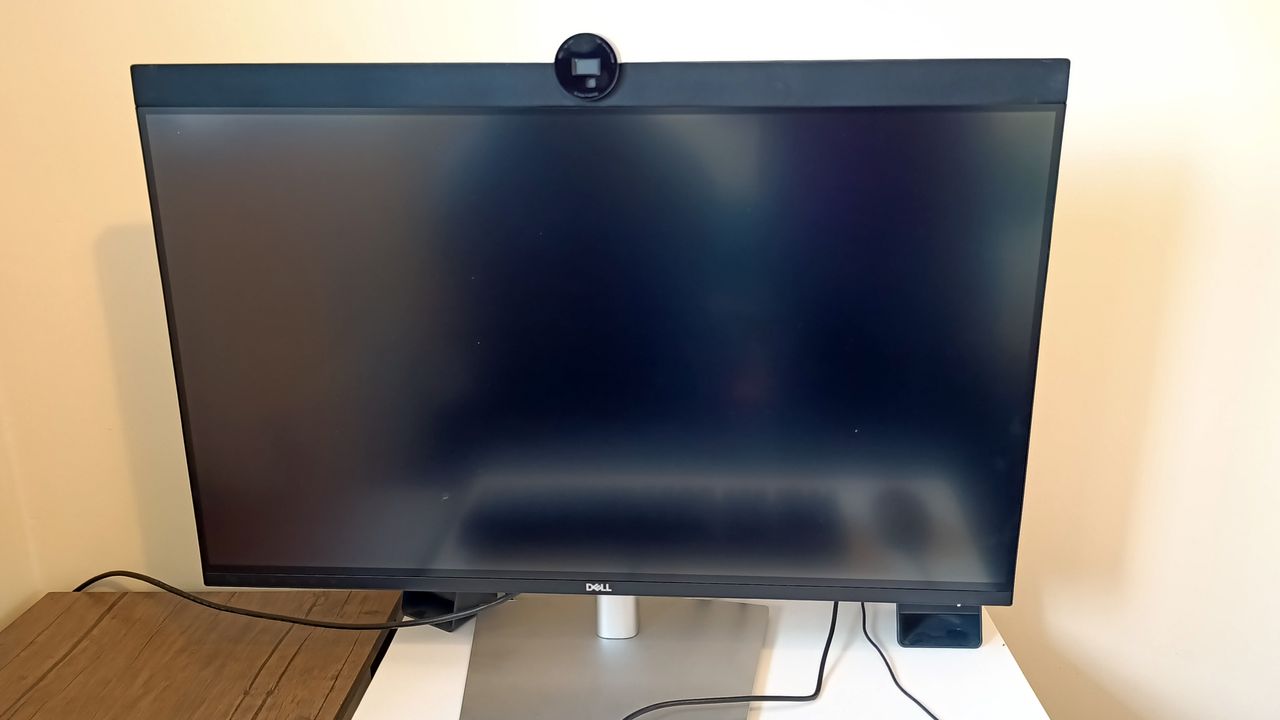 A Dell UltraSharp U3223QZ monitor sitting on a desk