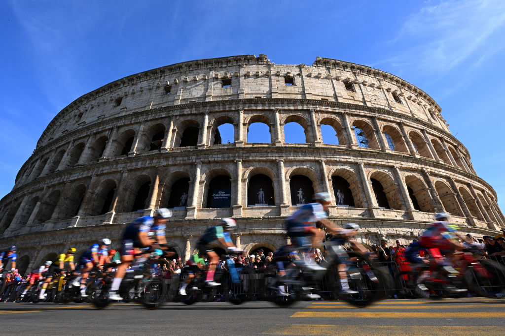 The peloton races past The Colosseum in Rome during the 2024 Giro d'Italia