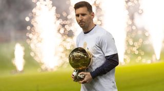 PARIS, FRANCE - DECEMBER 01: (BILD OUT) Lionel Messi of Paris Saint-Germain with the Ballon d´Or prior to the Ligue 1 Uber Eats match between Paris and Nice at Parc des Princes on December 1, 2021 in Paris, France. (Photo by Tnani Badreddine/DeFodi Images via Getty Images)