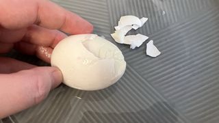 air fryer Egg being peeled