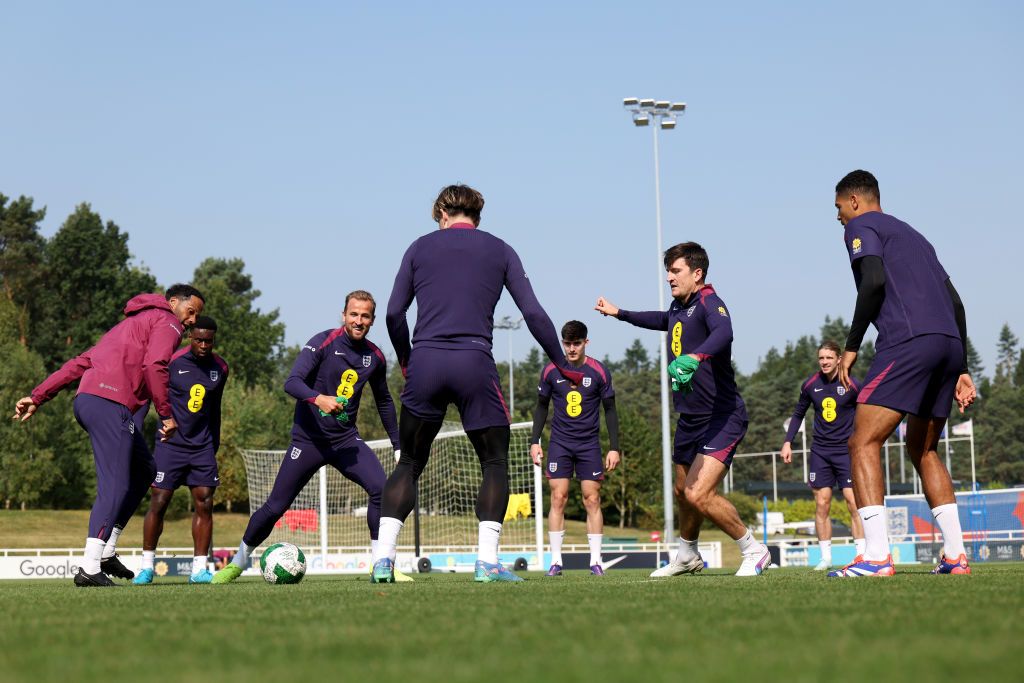 BURTON-UPON-TRENT, ENGLAND - SEPTEMBER 06: Joleon Lescott, England coach, looks on as Harry Maguire, Harry Kane, Jack Grealish, Levi Colwill and teammates of England pass the ball during a training session at St George&#039;s Park on September 06, 2024 in Burton-upon-Trent, England. (Photo by Eddie Keogh - The FA/The FA via Getty Images)