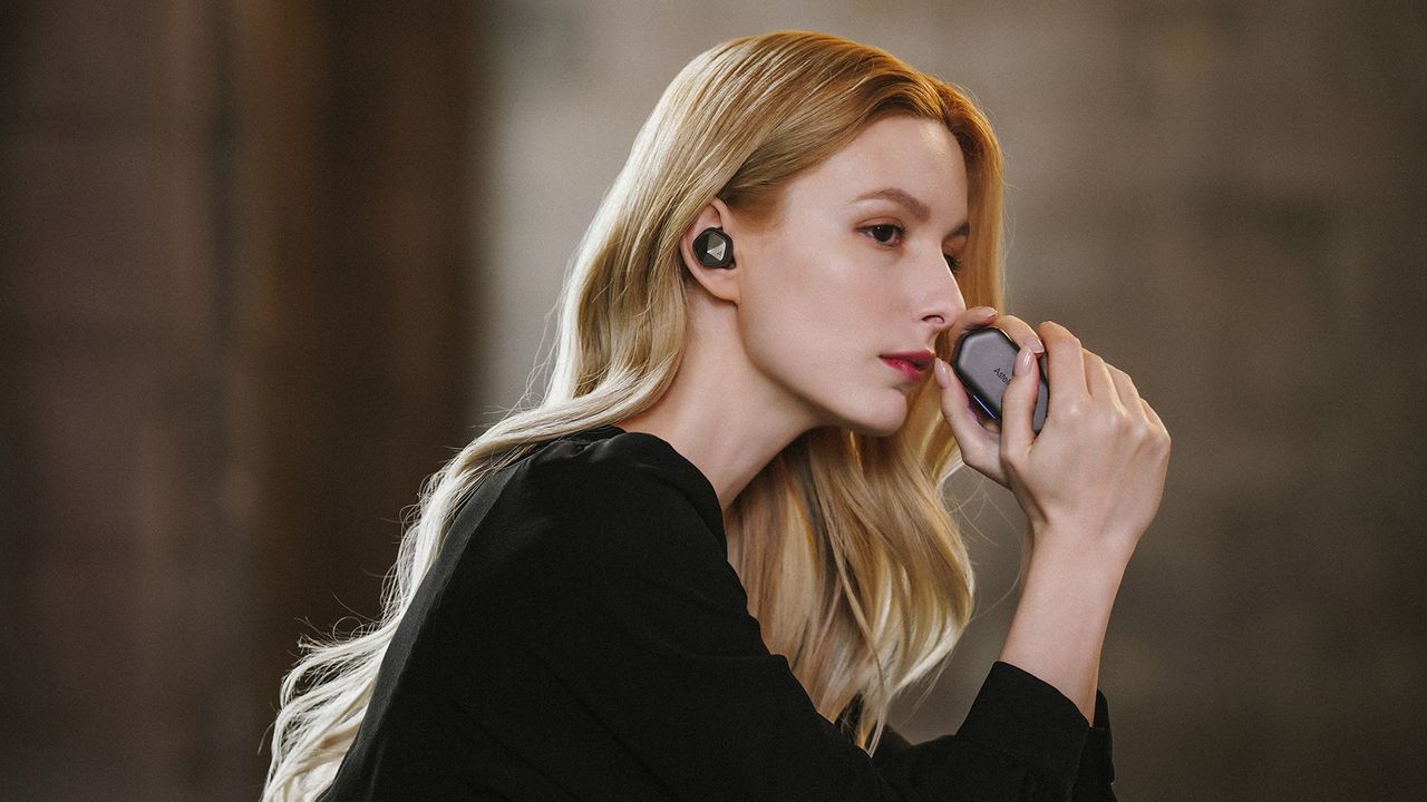 Astell&amp;Kern UW100 MK II earbuds in lifestyle shot