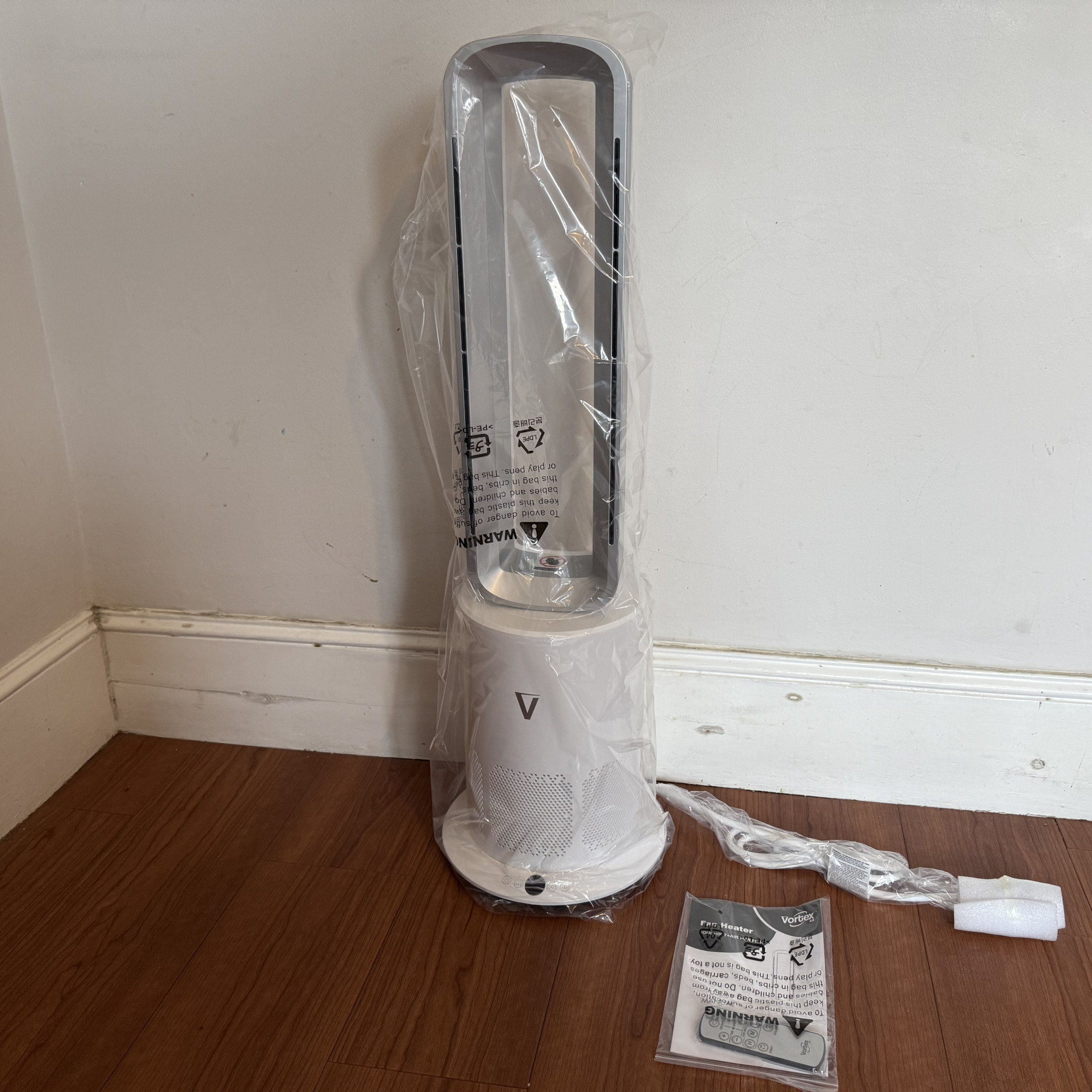 vortex air cleanse with instructions on a wooden floor
