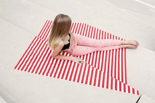 woman crosses her legs on carpet