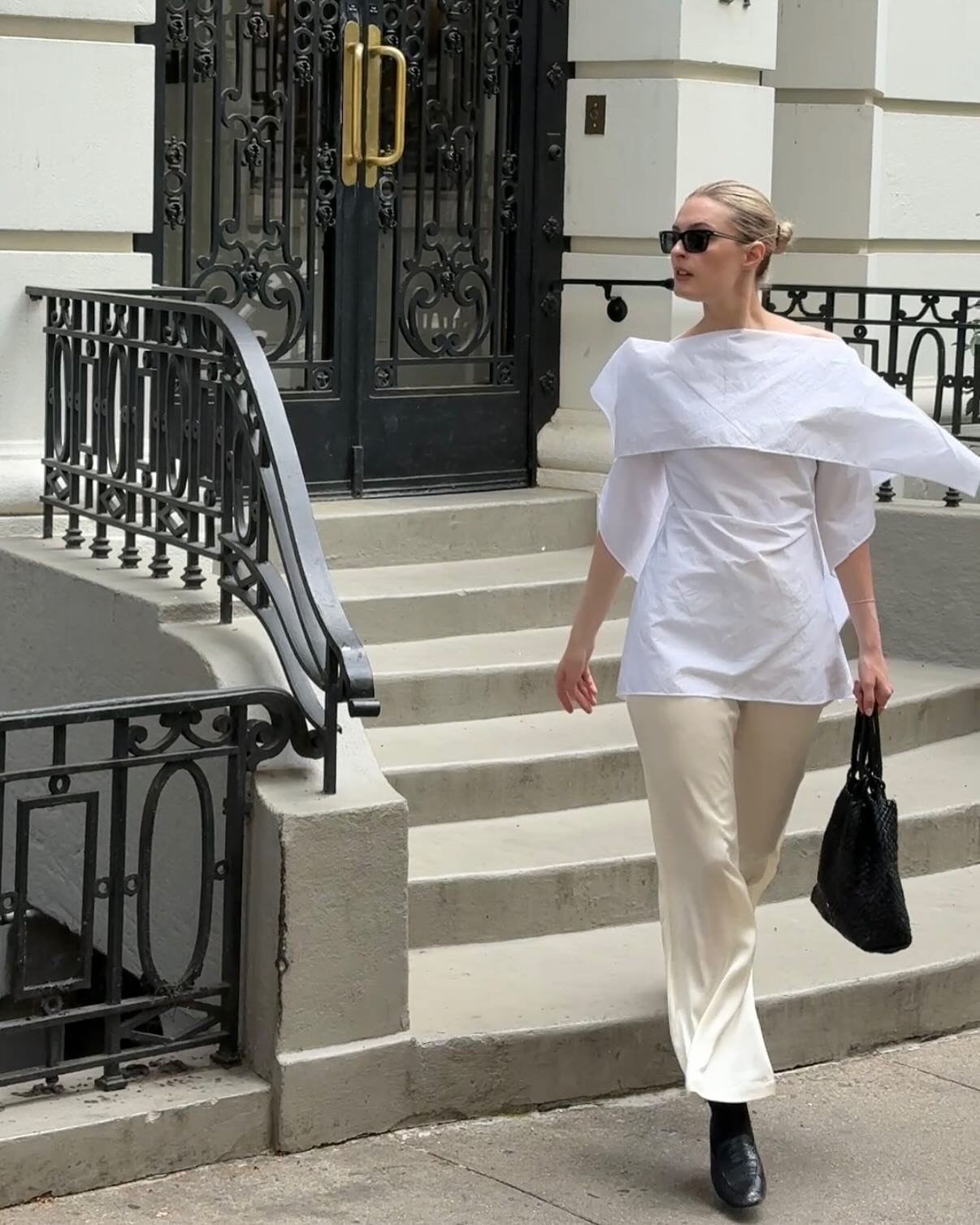 An image of @christietyler wearing a Rohé origami top, one of the key luxury independent fashion brands
