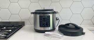 Crock-Pot Express with accessories on a kitchen countertop