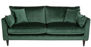 green velvet sofa with cushions