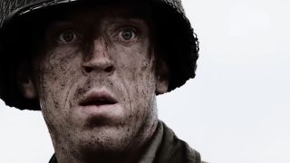 A close up of Winters with a very dirty face and a look of surprise in Band of Brothers