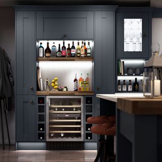 kitchen area with grey cabinet and drinks