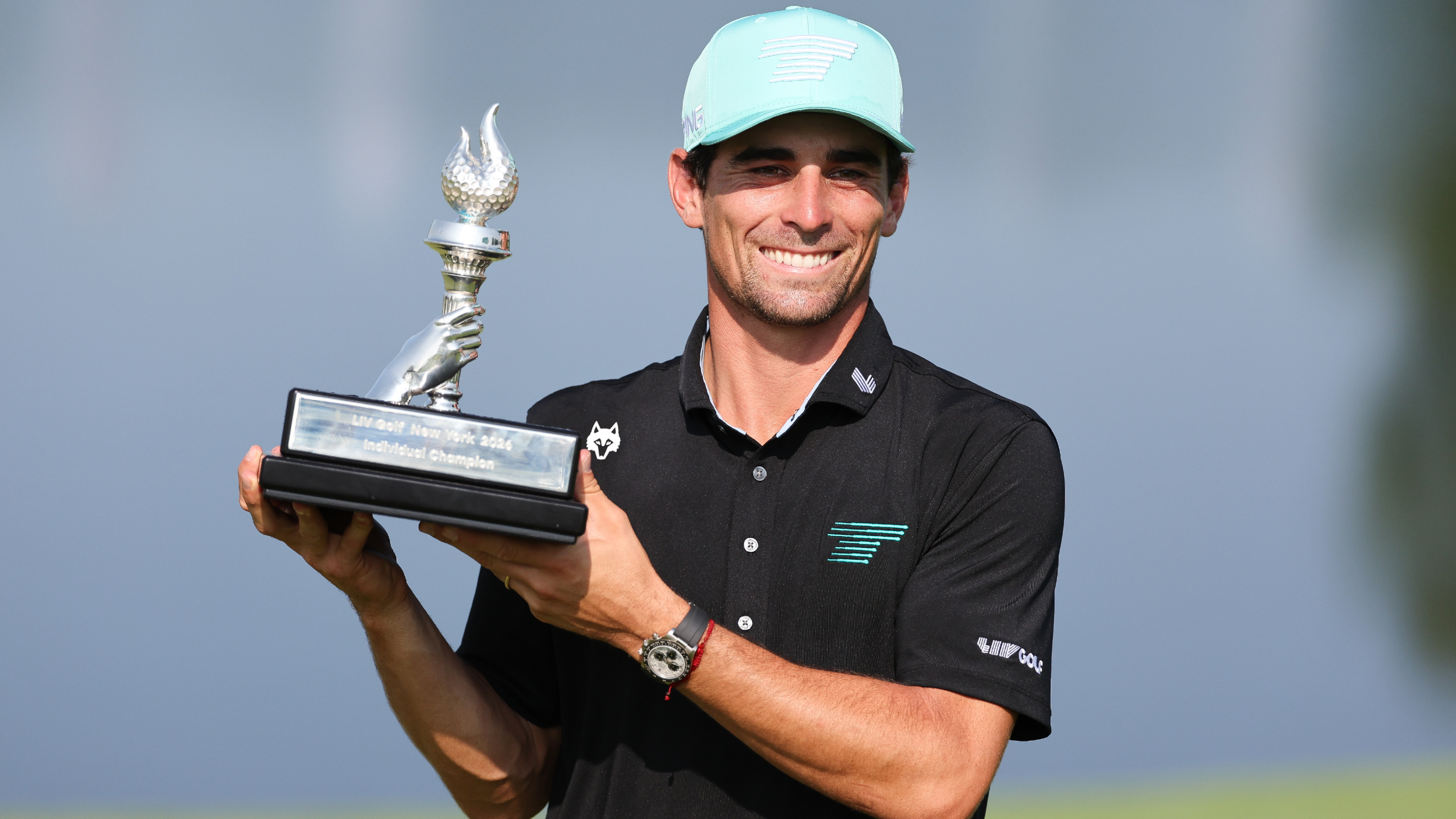 Joaquin Niemann with the LIV Golf New York trophy