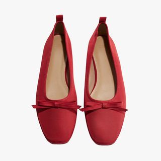 flat lay image of red ballet flats