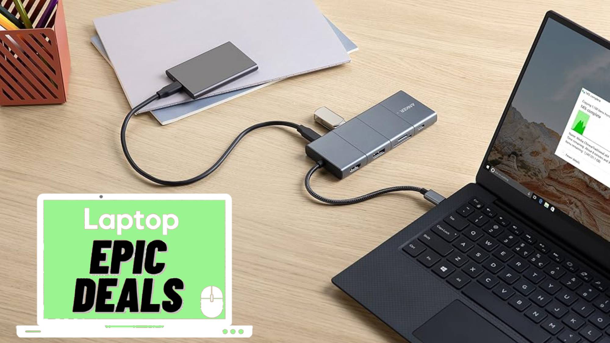 Anker power bank, usb-c docking station connected to a laptop.