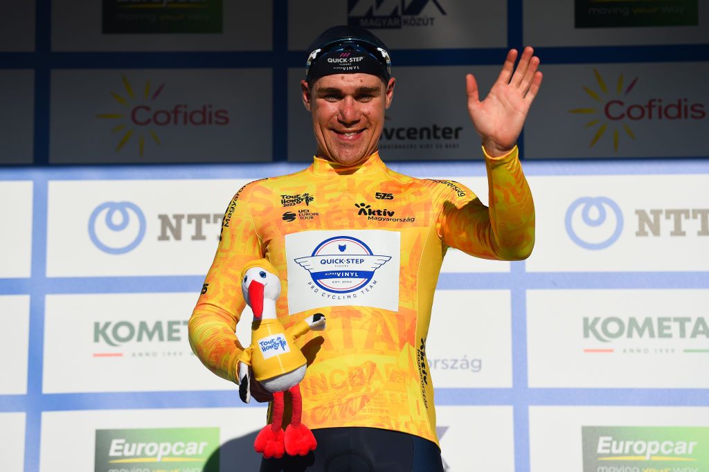 NYIREGYHAZA HUNGARY MAY 13 Fabio Jakobsen of Netherlands and Team QuickStep Alpha Vinyl celebrates winning the yellow leader jersey on the podium ceremony after the 43rd Tour de Hongrie 2022 Stage 3 a 154km stage from Sarospatak to Nyiregyhaza tourdehongrie on May 13 2022 in Nyiregyhaza Hungary Photo by Dario BelingheriGetty Images