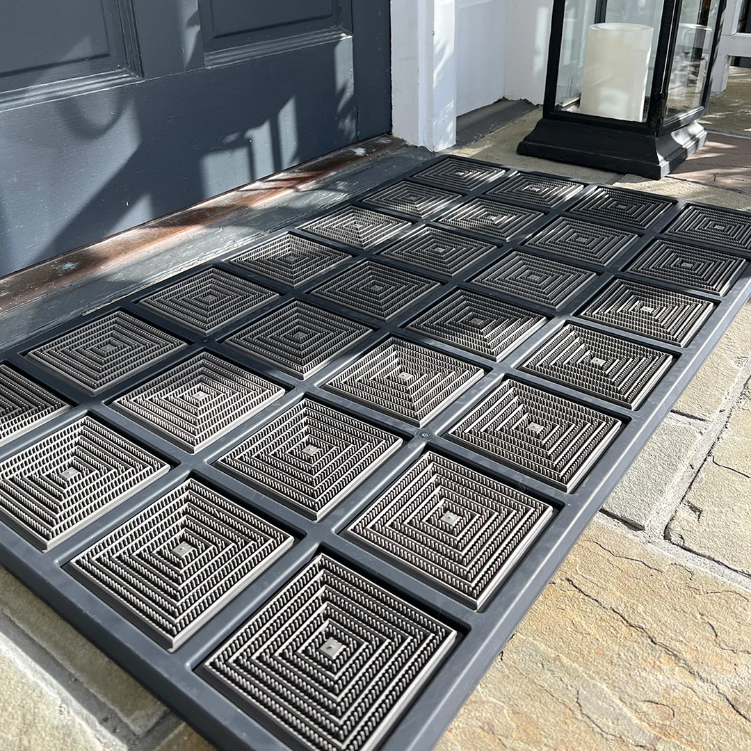 Blue and gray doormat with square pattern show outside 