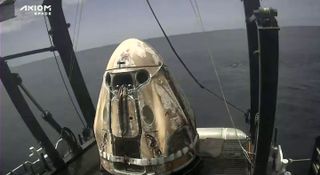 The Ax-1 SpaceX Dragon capsule on the deck of the recovery ship Megan shortly after splashdown on April 25, 2022.