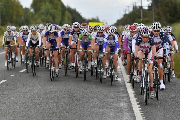 The peloton, led by USA National Team, is all back together.