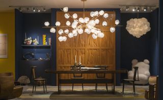 Showcased sculptural historic works by Joaquim Tenreiro, Jose Zanine and Wendell Castle with vibrant contemporary glass creations by Thaddeus Wolfe and a dramatic new lighting piece by Jeff Zimmerman