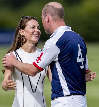 Prince William and Kate Middleton kissing at polo