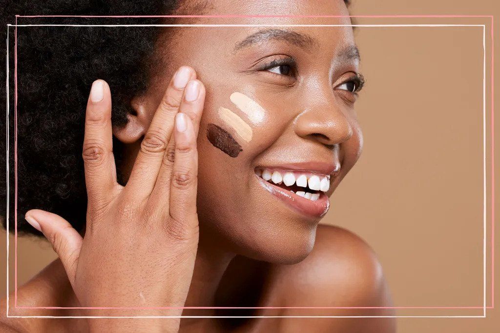 A shot of a woman with different foundation colours swiped on her face, to illustrate how you&#039;d use a foundation shade finder 