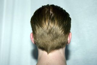 back of male models head with slick back hair
