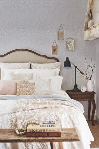 farmhouse bedroom with neutral tones and wallpaper