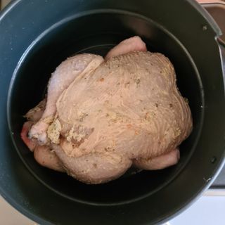 An uncooked chicken in the Instant Pot Pro crisp