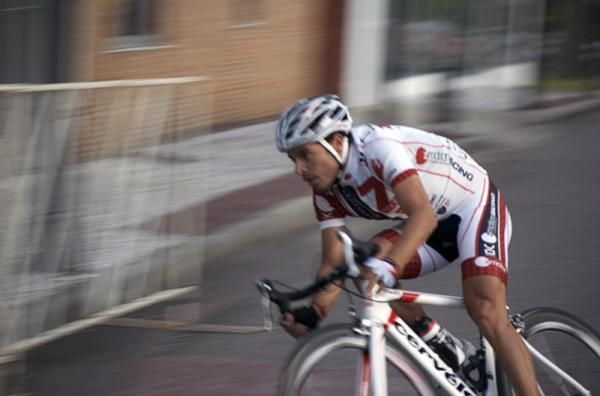A ZMOTION Racing Team rider leans into a turn.