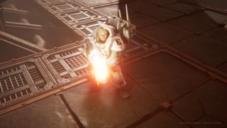 A member of the Leagues of Votann in white armor fires a gun