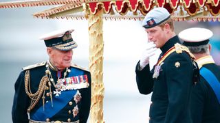 Prince Philip, Duke of Edinburgh and Prince Harry onboard the Royal Barge 'Spirit of Chartwell' during the Diamond Jubilee Thames River Pageant on June 3, 2012 in London, England.
