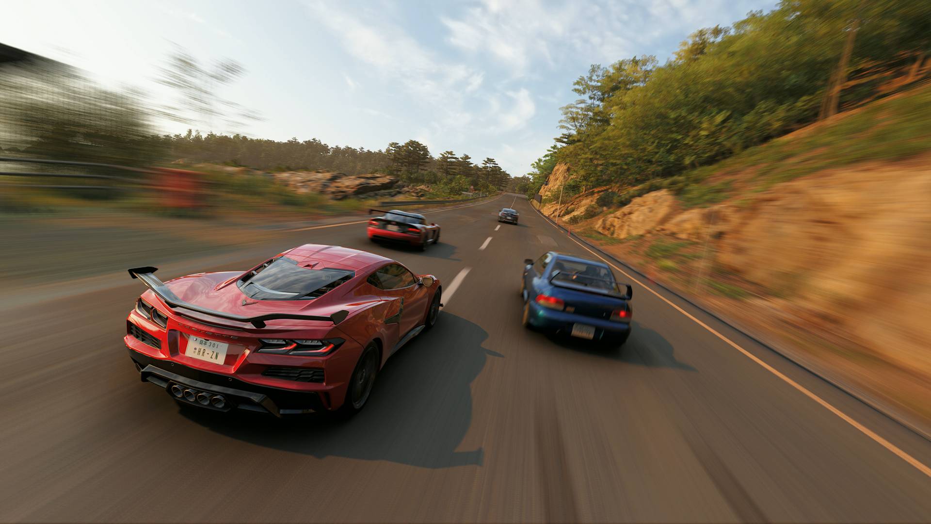 Forza Horizon 6 sports cars driving up road during a day trip