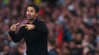 Mikel Arteta signals to his players during Arsenal's 2-2 draw against Fulham in August 2023.